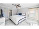 Bright, spacious main bedroom features marble floors, ceiling fan, and white and blue accents at 139 Wall St, Redington Shores, FL 33708