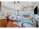 Spacious main bedroom with vaulted ceilings, ceiling fan, king bed and access to balcony at 139 Wall St, Redington Shores, FL 33708