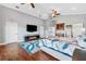 Bright main bedroom features hardwood floors, electric fireplace, and vaulted ceiling at 139 Wall St, Redington Shores, FL 33708