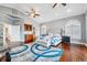 Bright main bedroom features hardwood floors, wet bar, arched windows, and a vaulted ceiling at 139 Wall St, Redington Shores, FL 33708