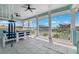 Covered patio featuring tile flooring, and outdoor seating with water views at 139 Wall St, Redington Shores, FL 33708