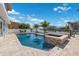 A luxurious backyard pool and waterfront views in a tropical setting with comfortable patio furniture at 139 Wall St, Redington Shores, FL 33708