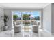 Bright seating area with water views, natural light, and marble floors at 139 Wall St, Redington Shores, FL 33708