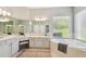 Spacious bathroom with dual vanities, a soaking tub, and a separate glass-enclosed shower at 14705 Canopy Dr, Tampa, FL 33626