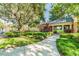 Well-maintained community entrance with lush landscaping and covered walkway at 14705 Canopy Dr, Tampa, FL 33626
