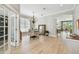 Elegant dining room featuring wood floors, decorative mirror, and ample natural light at 14705 Canopy Dr, Tampa, FL 33626
