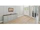 Elegant entryway with wood floors, stylish cabinet, and a bright, welcoming atmosphere at 14705 Canopy Dr, Tampa, FL 33626