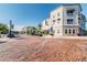 Attractive community buildings with meticulously laid brick street, palm trees, and inviting streetscape at 14705 Canopy Dr, Tampa, FL 33626