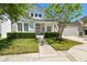 Inviting two-story home with a manicured lawn, charming front porch, and attached garage at 14705 Canopy Dr, Tampa, FL 33626