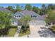 Charming two-story home boasts a well-manicured lawn and a two-car garage at 14705 Canopy Dr, Tampa, FL 33626