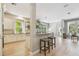 Bright, open kitchen features a breakfast bar, white cabinetry, and stainless steel appliances at 14705 Canopy Dr, Tampa, FL 33626