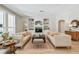 Spacious living room with built-in shelving, neutral décor, and lots of natural light at 14705 Canopy Dr, Tampa, FL 33626