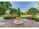 Serene park with mature trees, benches, and a paved seating area at 14705 Canopy Dr, Tampa, FL 33626