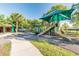 Community playground with slides, swings, and a shaded picnic area at 14705 Canopy Dr, Tampa, FL 33626