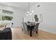 Bright dining area features modern lighting, table with seating, and seamless access to outdoor living at 1514 55Th N Ave, St Petersburg, FL 33703