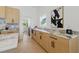 Kitchen with marble counters and backsplash and light wood cabinets at 1514 55Th N Ave, St Petersburg, FL 33703