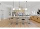 Modern kitchen with a marble island, pendant lighting, stainless steel appliances, and sleek cabinetry at 1514 55Th N Ave, St Petersburg, FL 33703