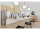 Modern kitchen featuring a large island, stainless steel appliances, and stylish pendant lights at 1514 55Th N Ave, St Petersburg, FL 33703