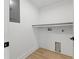Bright laundry room with built-in shelf and convenient hookups, ready for washer and dryer at 1514 55Th N Ave, St Petersburg, FL 33703