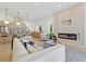 Open concept living area with fireplace, island with seating, and view of the kitchen at 1514 55Th N Ave, St Petersburg, FL 33703