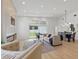 Bright living room with fireplace, recessed lighting, dining area, and a sliding glass door to the backyard at 1514 55Th N Ave, St Petersburg, FL 33703