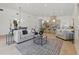 Open concept living room with kitchen, dining area, and fireplace at 1514 55Th N Ave, St Petersburg, FL 33703