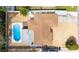 Aerial view of backyard featuring large pool, gravel ground cover and lush vegetation at 1758 Southview Rd, Largo, FL 33770