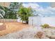 Spacious backyard with a shed, mature trees, and a privacy fence at 1758 Southview Rd, Largo, FL 33770