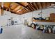 Unfinished basement with washer, dryer, utility sink and exposed ceiling at 1758 Southview Rd, Largo, FL 33770