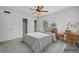 Bedroom includes a double bed, desk, and closet space with white walls at 1758 Southview Rd, Largo, FL 33770