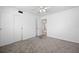 Spacious bedroom featuring soft carpet, closet, ceiling fan, and natural light at 1758 Southview Rd, Largo, FL 33770