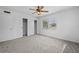 Spacious bedroom with large closet, plush carpet and window views to the neighborhood at 1758 Southview Rd, Largo, FL 33770