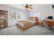 Cozy bedroom with modern furnishings, ceiling fan, and a bright window at 1758 Southview Rd, Largo, FL 33770