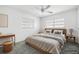 Comfortable bedroom featuring plush carpeting, neutral tones, and natural lighting at 1758 Southview Rd, Largo, FL 33770