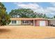 Charming single-story home with a brick facade, attached garage, and well-maintained landscaping at 1758 Southview Rd, Largo, FL 33770
