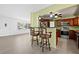 Kitchen area featuring a breakfast bar, stainless steel appliances, and modern finishes at 1758 Southview Rd, Largo, FL 33770