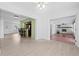 Open-concept living space with light wood floors and neutral decor at 1758 Southview Rd, Largo, FL 33770