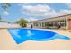 Inviting backyard pool with a spacious deck, perfect for outdoor entertaining and relaxation on a sunny day at 1758 Southview Rd, Largo, FL 33770