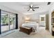 Inviting main bedroom with french doors, and an ensuite bathroom at 17605 Simmons Rd, Lutz, FL 33548