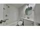 Clean, well-lit bathroom with a shower-tub combo and modern fixtures at 1835 Nevada Ne Ave, St Petersburg, FL 33703