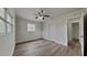 Cozy bedroom with a ceiling fan, closet, and access to a bathroom at 1835 Nevada Ne Ave, St Petersburg, FL 33703