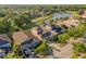 This aerial view shows a desirable neighborhood near a scenic pond surrounded by lush greenery at 20146 Heritage Point Dr, Tampa, FL 33647