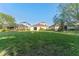 The large backyard provides ample space and backs to adjacent properties with mature landscaping at 20146 Heritage Point Dr, Tampa, FL 33647