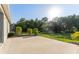 Concrete patio overlooking a well-maintained backyard with lush greenery at 20146 Heritage Point Dr, Tampa, FL 33647