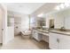 Luxurious bathroom with dual vanity, soaking tub, and walk-in shower at 20146 Heritage Point Dr, Tampa, FL 33647