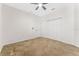 Neutral bedroom with carpeted floors, ceiling fan, and closet for comfortable living at 20146 Heritage Point Dr, Tampa, FL 33647