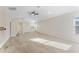 Expansive bonus room with plenty of light from windows, carpeted floor, and fan at 20146 Heritage Point Dr, Tampa, FL 33647