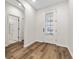 Inviting foyer with wood floors, and open floor plan. Features include natural light and storage space at 20146 Heritage Point Dr, Tampa, FL 33647