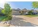 Inviting single-Gathering home boasting well-maintained landscaping, a two-car garage, and a welcoming entrance at 20146 Heritage Point Dr, Tampa, FL 33647