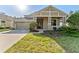 Charming single-Gathering home with manicured lawn and attached two-car garage, offering great curb appeal at 20146 Heritage Point Dr, Tampa, FL 33647